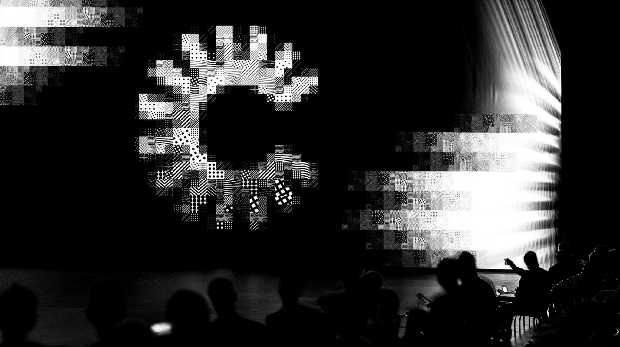collective01_A_technology_conference_auditorium_with_a_big_LE_e8b07369-1fc8-4968-a7d8-b226713ba954_1.png